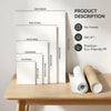 A set of white, premium eco-friendly PP posters in various sizes displayed on a wooden table.