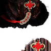 Antique copper five emperor coin pendant with a Chinese knot hanging from a red silk thread.