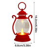 A red retro battery-powered desk lamp with a clear glass globe and a metal top.