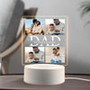 A personalized photo acrylic night light displaying multiple photos of a father and his children.
