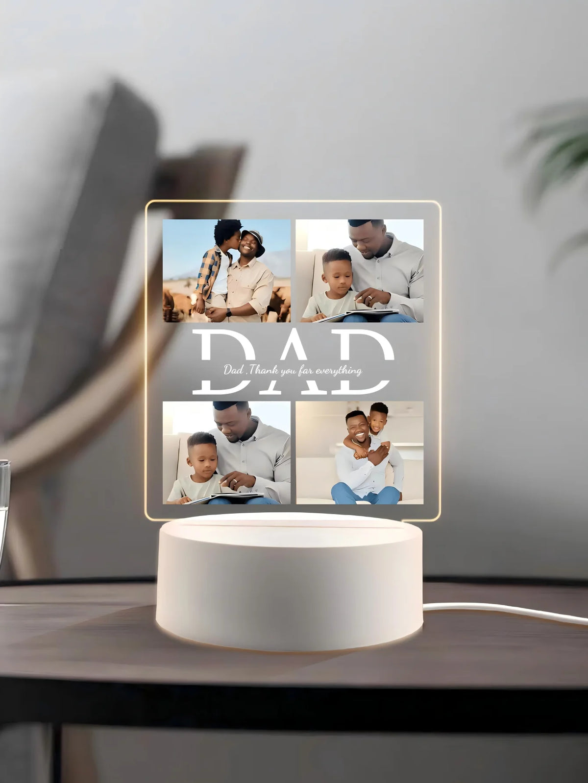 A personalized photo acrylic night light displaying multiple photos of a father and his children.