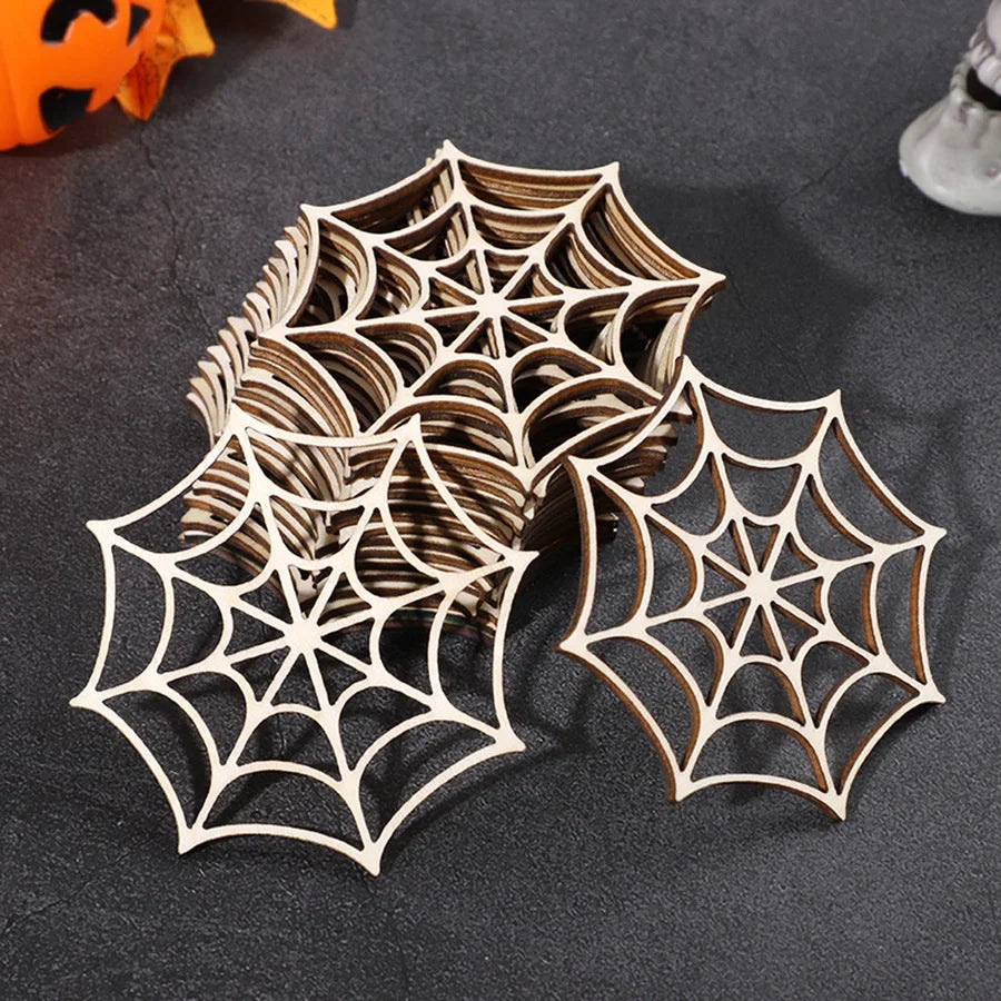 A collection of intricate wooden spider web ornaments in various sizes and shades displayed on a dark surface.