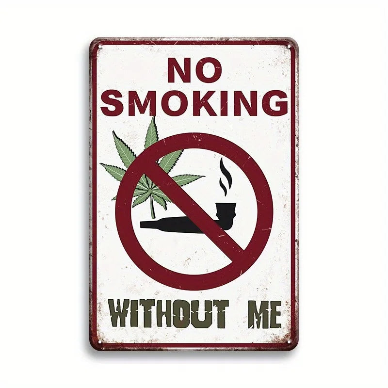 A vintage metal tin sign with a distressed white background and red text that reads NO SMOKING WITHOUT ME