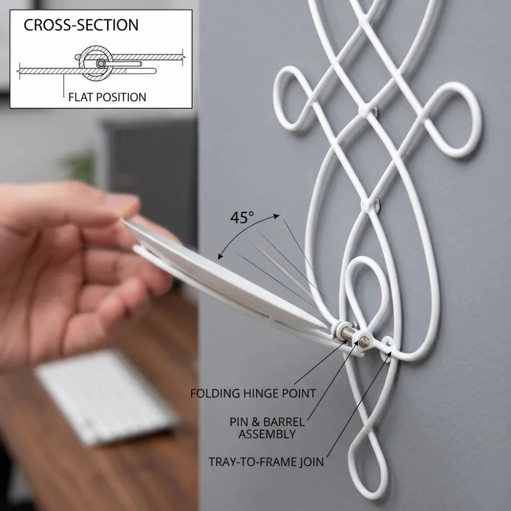 A hand demonstrates the folding hinge point and pin & barrel assembly of a white decorative iron wall candle sconce set.