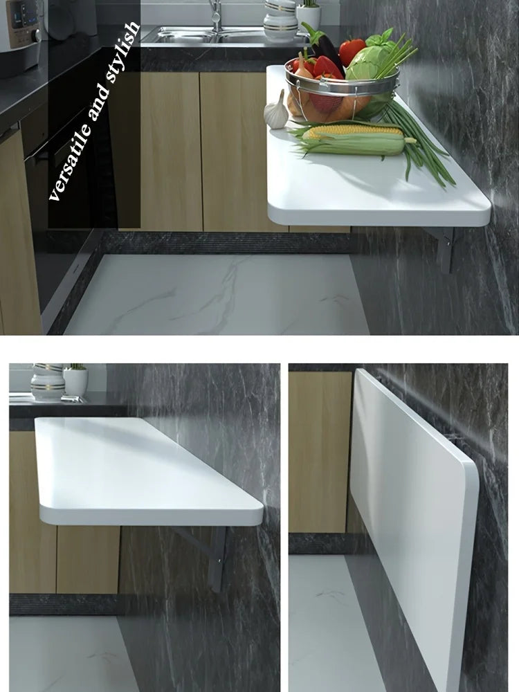 A kitchen countertop features a white wooden shelf with a black marble backsplash and a bowl of fresh vegetables.