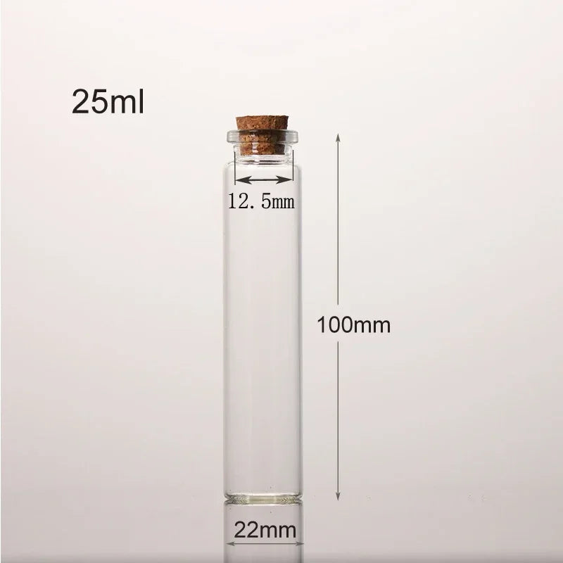 A clear glass bottle with a cork stopper, labeled 25ml, and dimensions of 100mm height and 22mm base.
