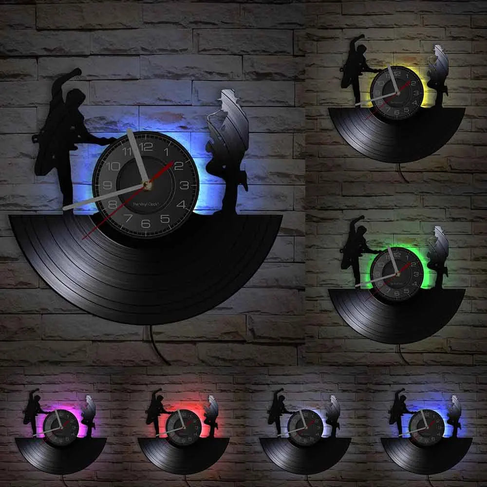 A wall clock featuring a vintage vinyl record design with silhouettes of people and a bird, illuminated by purple and blue li