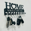 Black metal key holder with wall mounted hooks featuring the text HOME SWEETHOME