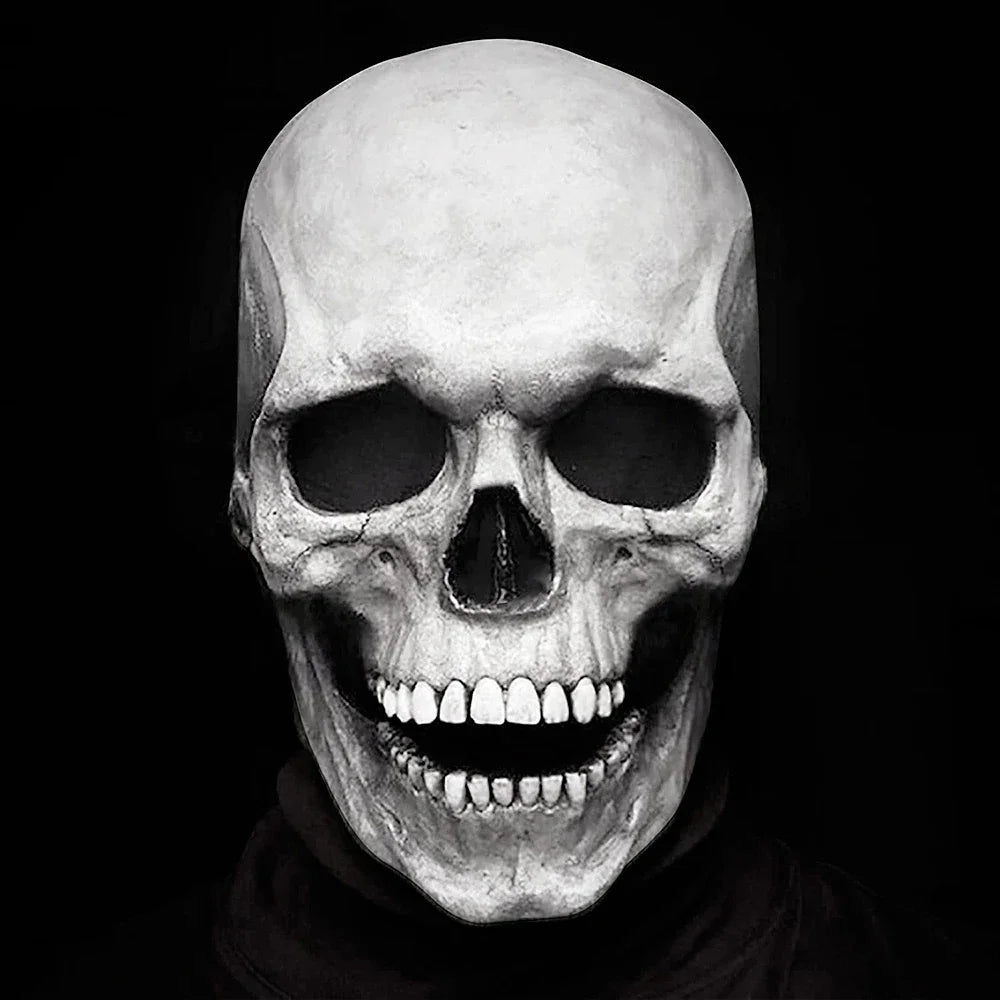A realistic white skull mask with a wide, grinning mouth is displayed against a black background.