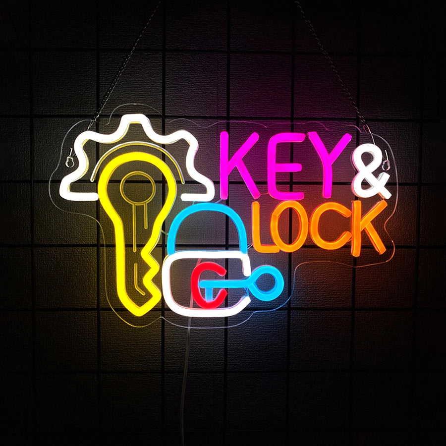 Neon light art showing a key and lock symbol glowing in yellow, pink, and orange on a dark background.