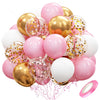 A pile of pastel pink and white latex balloons with metallic gold confetti accents.