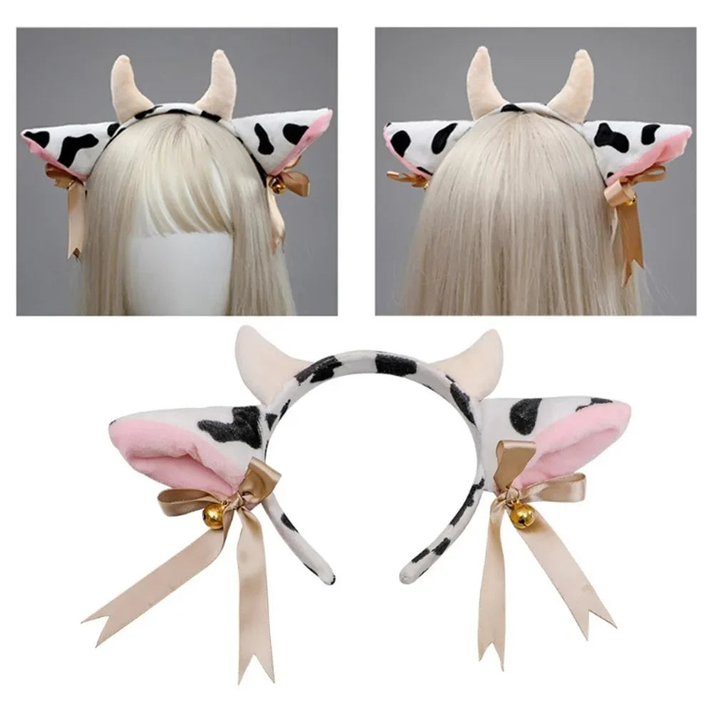 A headband featuring cow ears with black and white patches, adorned with bells and ribbon bows.