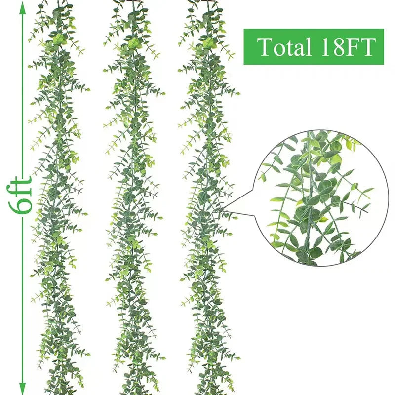 Three vertical strands of artificial green plant vines showing the length and texture.