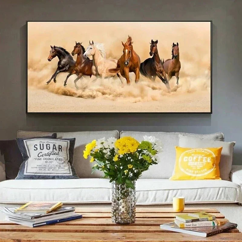 Modern canvas wall art print depicting several horses galloping through dry, dusty terrain.