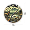 Vintage hunting scene metal wall sign featuring a deer and rifle silhouette against a mountain backdrop.
