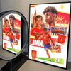 A framed poster print featuring Lamine Yamal in a red jersey against a gold background.