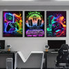 Three vibrant canvas wall art prints featuring retro gaming themes like controllers and keyboards.