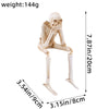 A white skeleton figurine set depicting the theme See No Evil Hear No Evil Speak No Evil