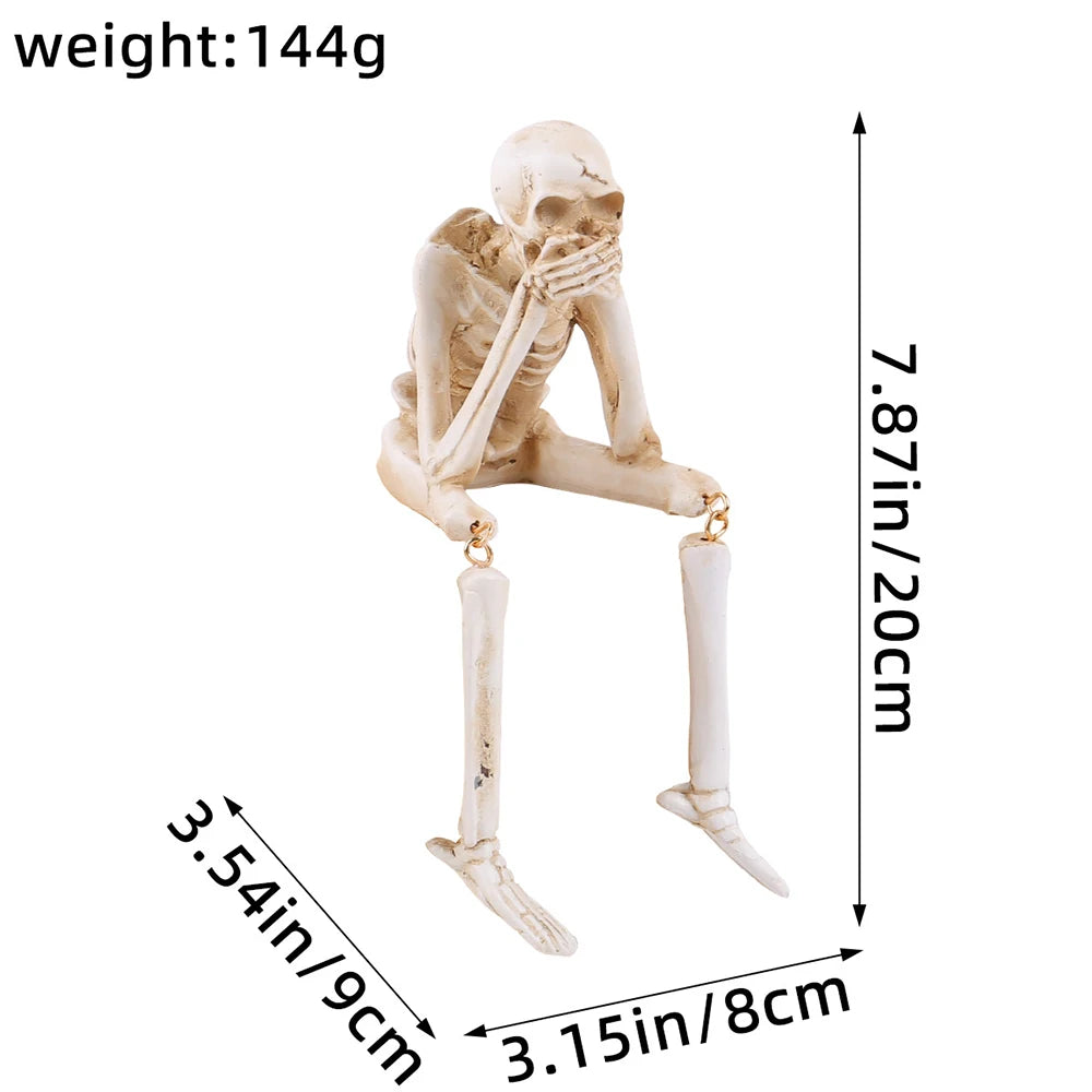 A white skeleton figurine set depicting the theme See No Evil Hear No Evil Speak No Evil