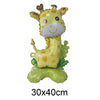 A foil balloon shaped like a smiling yellow giraffe with brown accents and green foliage.