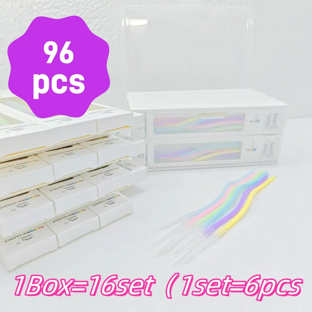 A box containing 16 sets of elegant spiral cake candles, with 96 pieces total and a set of six thin birthday candles.