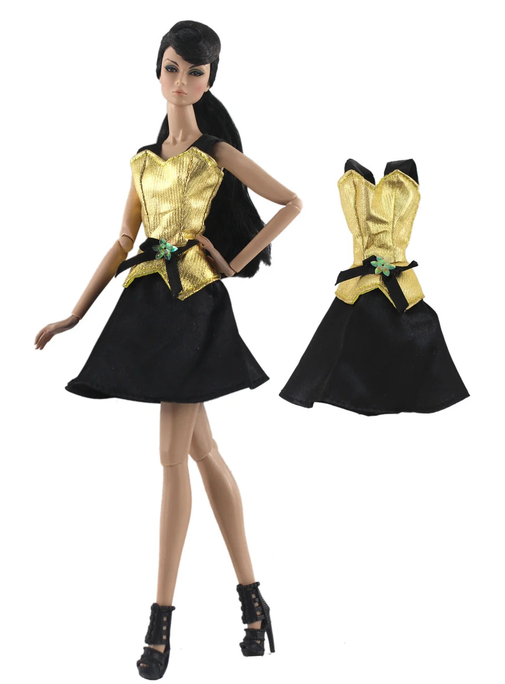 A handmade doll dress gown featuring a black skirt and gold bodice with green accents.