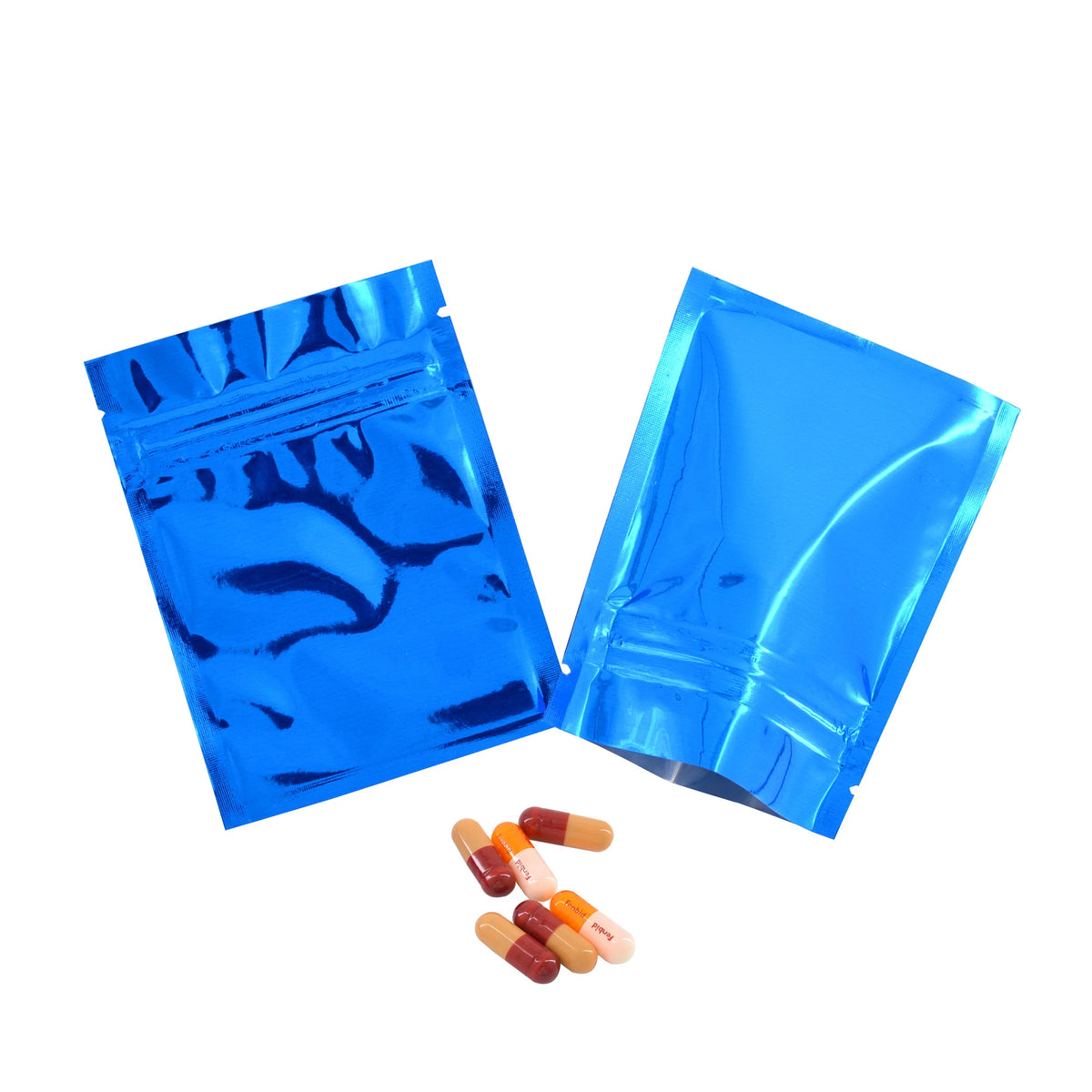 Two bright blue foil zip bags containing several small pills or tablets.