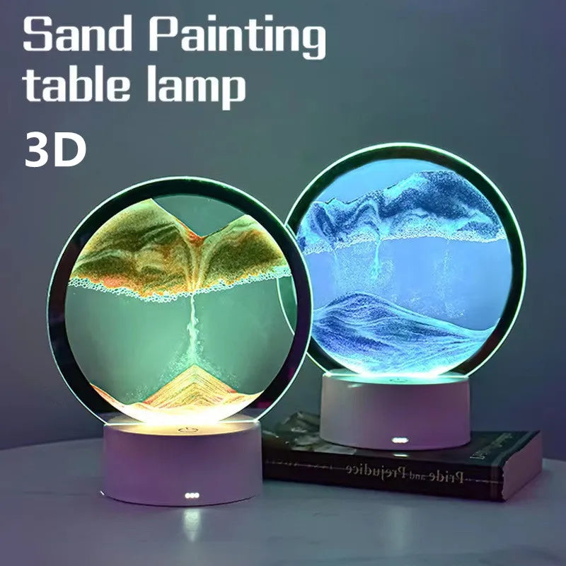 A 3D sand painting table lamp with a glowing blue and green light illuminating a textured surface.