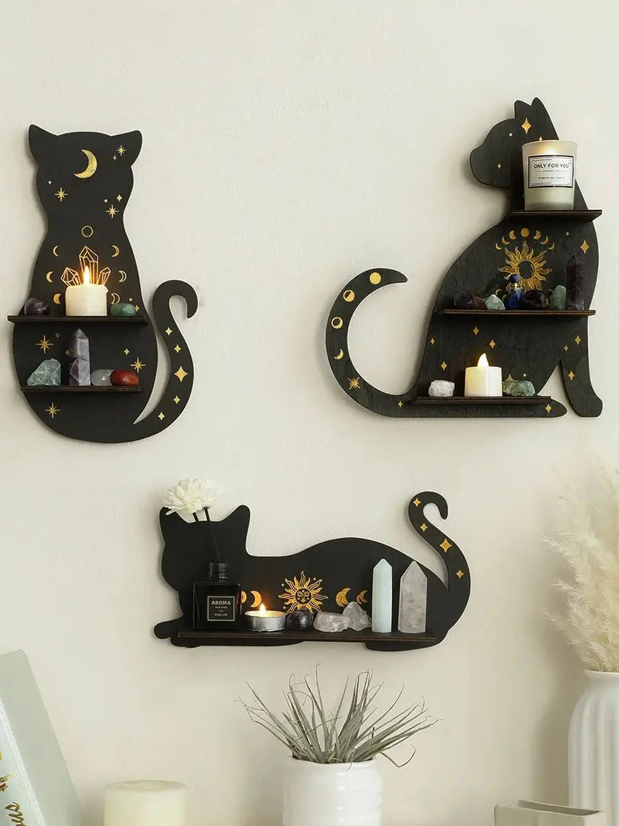 A black cat wall shelf featuring a silhouette of a cat with a crescent moon, holding candles and crystals.
