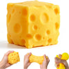 A large yellow cheese squishy toy is shown in various forms and being held by hands.