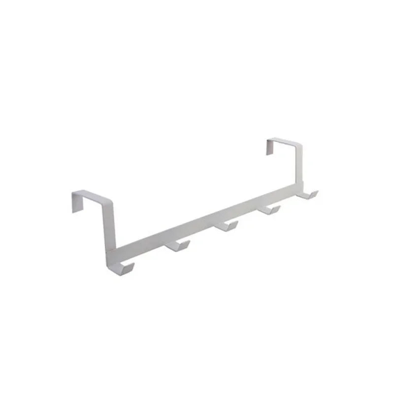 A white iron door and wall organizer rack with five hooks.
