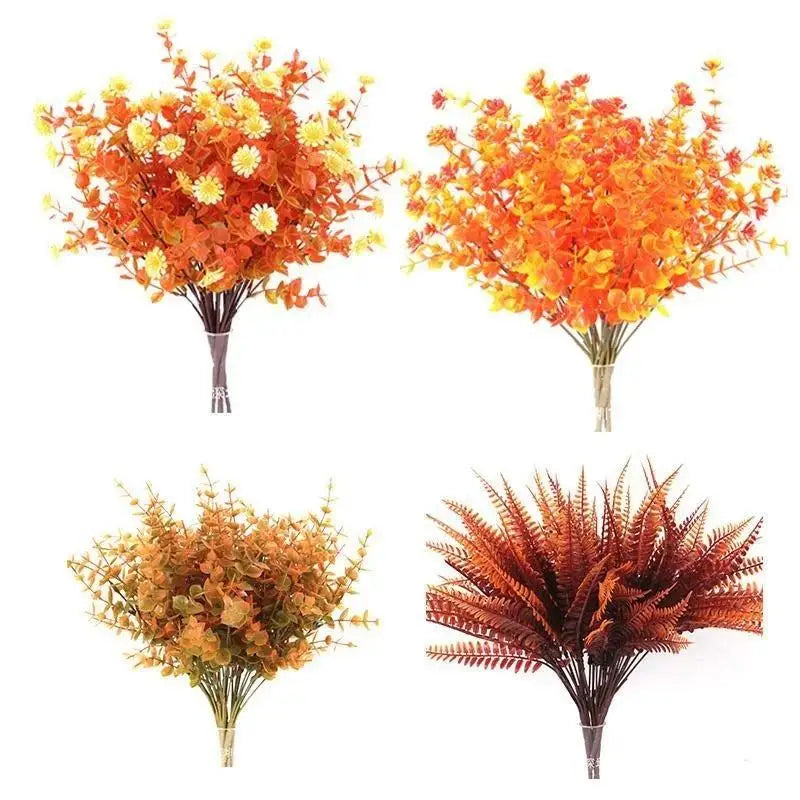 A bouquet of artificial fall flowers featuring vibrant orange and yellow foliage for home decor