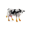 A realistic figurine of a black and white cow with pink accents.