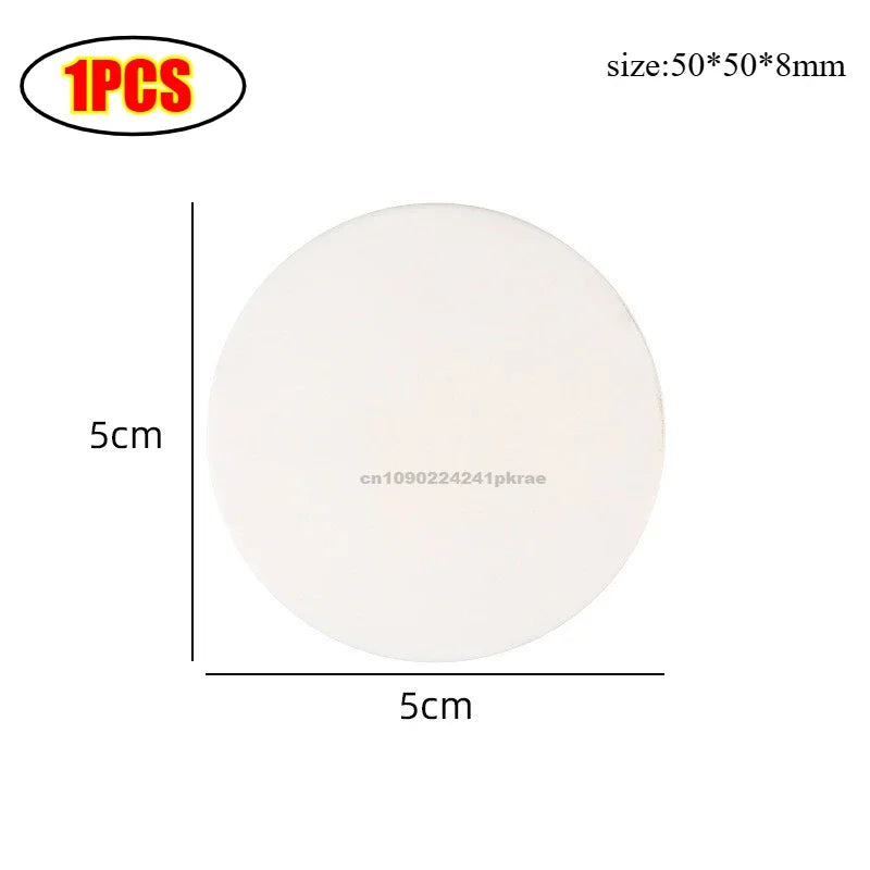 A round, white silicone door stopper bumper with a 5cm diameter and 8mm thickness.