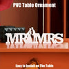 PVC table ornament featuring the initials MR MRS cut from white resin displayed on a wooden surface
