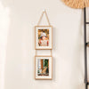 A set of two wooden photo frames hanging on a wall, featuring a portrait and an animal picture.