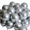 A pile of chrome metallic balloons used for celebrations.