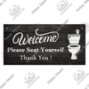 A rustic wooden wall sign with white text that reads Welcome Please Seat Yourself Thank You and features a toilet silhouette.