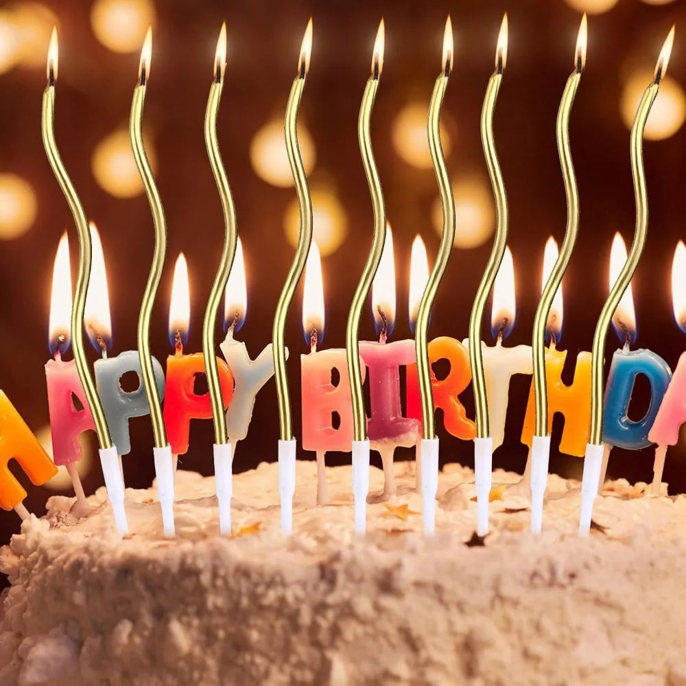 Birthday candles shaped like letters spelling HAPPY BIRTHDAY arranged on a light-colored cake