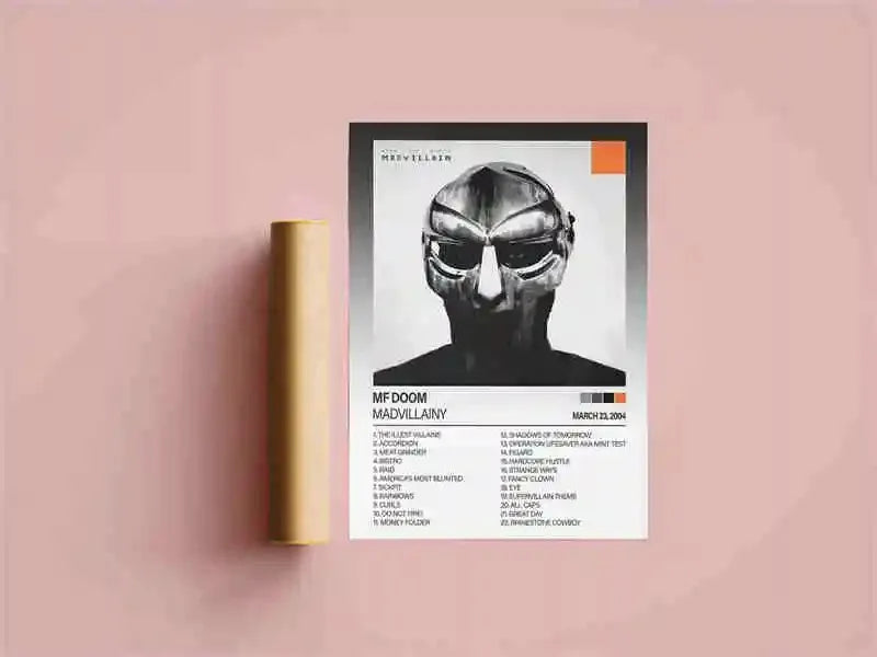 A black and white poster featuring a stylized face, titled MF DOOM MADVILLAINY, displayed against a pink wall.