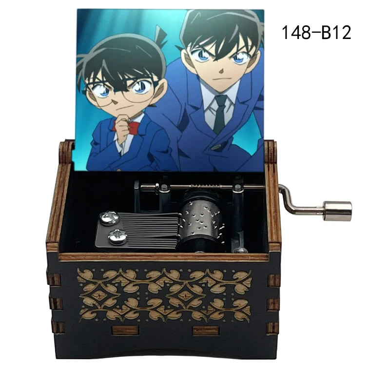A wooden music box featuring an anime character design, likely from Detective Conan, with a metal mechanism visible inside.