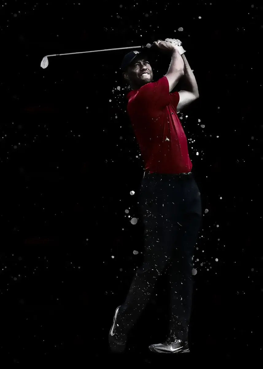 A man in a red shirt is shown swinging a golf club against a black background, creating a spray of white particles.