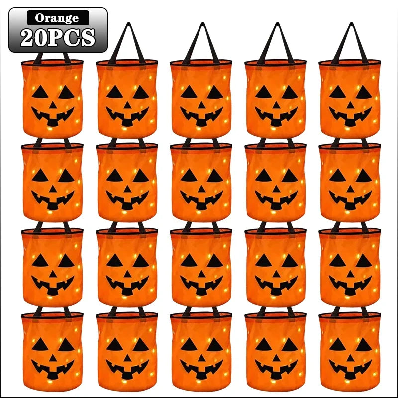 Orange Halloween pumpkin tote bags with black carved faces and light-up handles