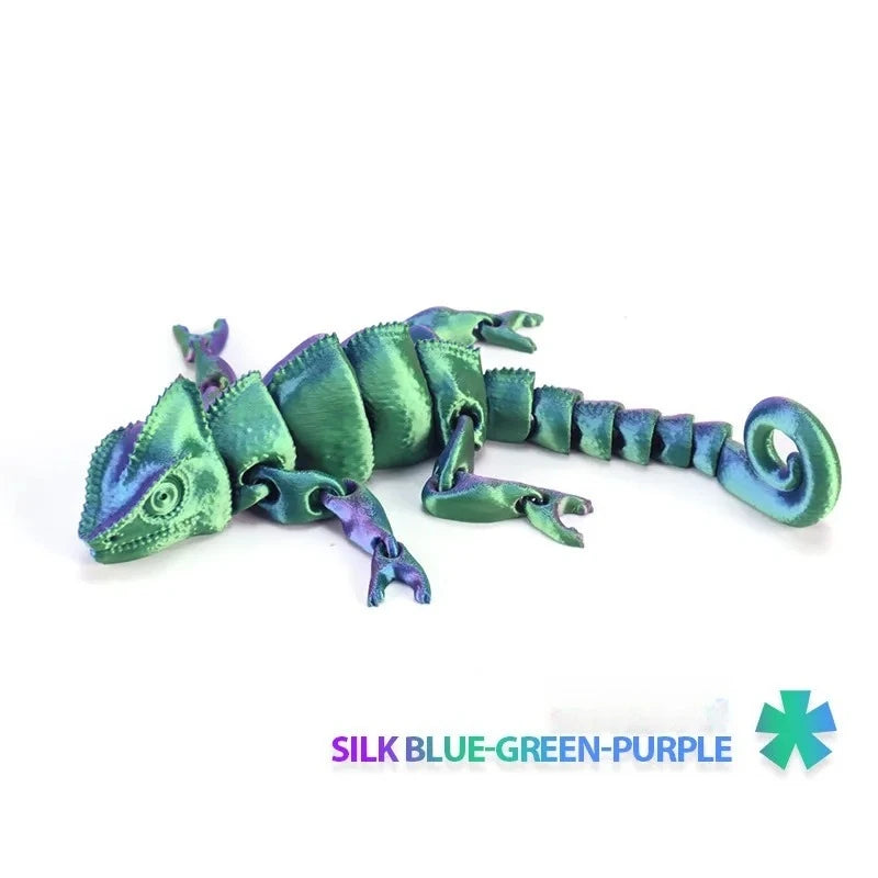 A silk blue-green-purple articulated dragon lizard figurine.