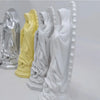A collection of delicate and exquisite resin statues depicting Our Lady of Guadalupe in various colors.