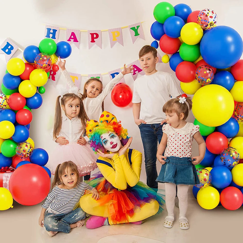 A colorful balloon garland arch featuring various colored balloons and star foil accents for a party decoration.