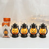 Four orange glowing LED pumpkin and ghost hanging lanterns displayed against a white background.