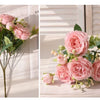 A bouquet of pink silk peony flowers arranged for weddings and home decor.