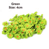 A cluster of green artificial sunflower and daisy heads, size 4cm.