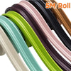 Roll of self-adhesive flexible wall skirting strips in various colors like green, pink, and black.